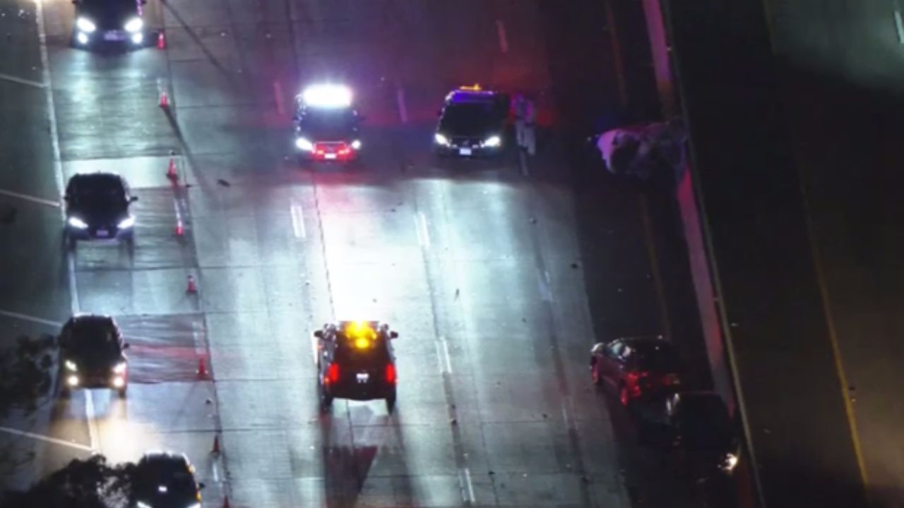1 dead, 1 fighting for life after car bursts into flames on 10 Freeway — bystanders detained a suspect at the scene